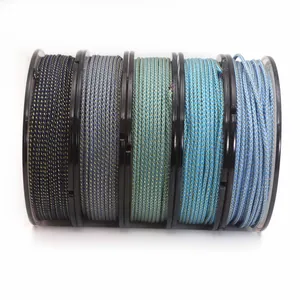 Detailed view of five spools of metallic mambo braiding cords in varying blue tones.