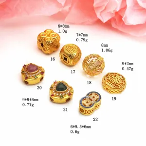 Detail of gold-plated charms with size and weight for DIY jewelry making