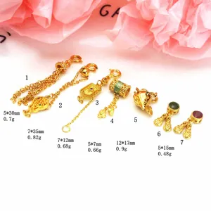 Detailed view of various sand gold charms including tassels with size and weight parameters