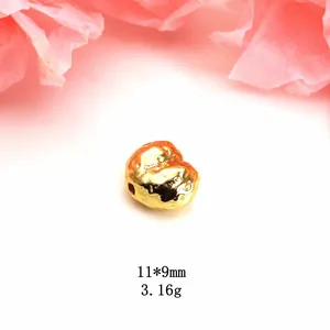 Close-up of irregular gold baroque bead with dragon scale texture size 11x9mm weight 3.16g