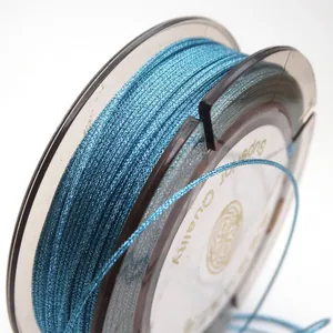 Close-up of 0.85mm metallic blue braided cord for DIY jewelry making on a spool.
