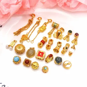 A beautiful collection of gold plated jewelry charms and beads for DIY bracelet making