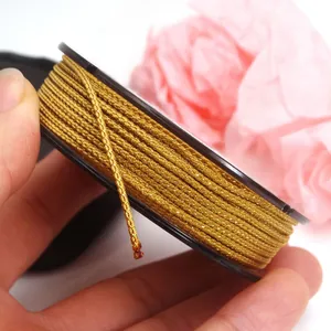 Close-up detail of premium golden metallic Mambo cord for DIY jewelry weaving projects