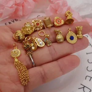 Collection of sand gold charms including lotus and gourd pendants for DIY jewelry