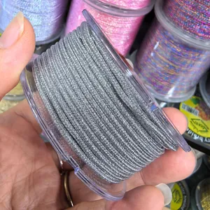 Close-up of silver 2.0mm metallic Milan cord for DIY jewelry braiding and gift wrapping