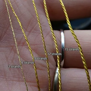 Comparison of gold metallic embroidery threads in various thicknesses from 3 to 15 strands