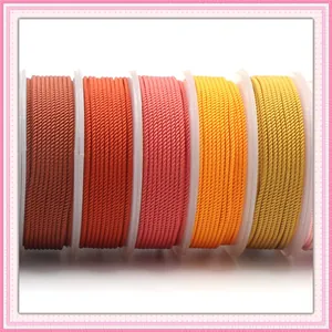 Multi-colored 4mm Milan braided cord spools in warm shades for DIY necklace and jewelry making