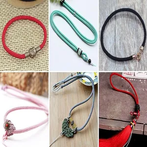 Close-up of various DIY Milanese jewelry cords in multiple colors and designs