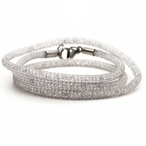 Detailed view of silver metallic mesh tube necklace filled with white sparkling crystals