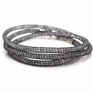 Detailed close-up view of a grey mesh tube necklace filled with sparkling Austrian crystals