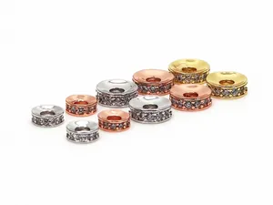 Detailed view of micro-pave CZ rondelle spacer beads in gold, silver and rose gold finishes