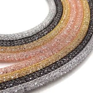 Detailed close-up of colorful mesh tube necklaces filled with sparkling Austrian crystals