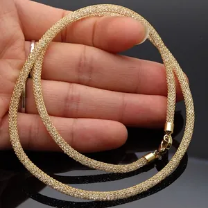 Elegant gold-tone woven mesh hose necklace filled with sparkling Austrian crystals