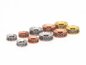 Detailed macro view of micro-pave cubic zirconia spacer beads in gold and silver
