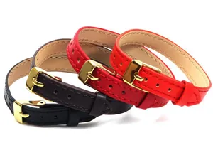 Detail showing three 10mm leather bracelets in black, brown and red with gold buckles
