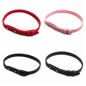 Four slim leather belt style bracelets in red pink black and brown with gold stud accents