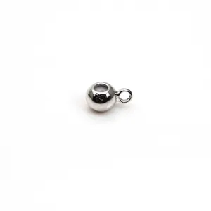 Close-up of a silver-plated positioning bead with silicone core and side loop