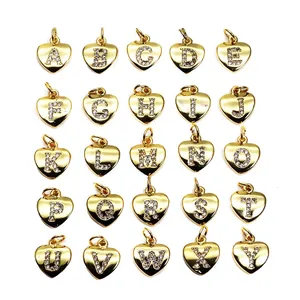 Collection of gold heart-shaped pendants with micro-pave CZ alphabet letters for DIY jewelry