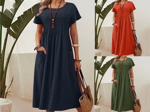 Solid color pleated cotton linen dress with pockets shown in three elegant summer colors