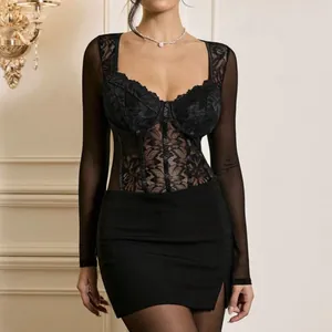 Detail of black lace long-sleeve bodysuit with sheer mesh panels and sweetheart neckline