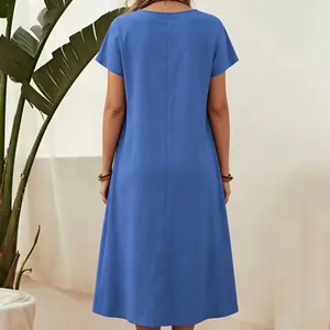 Back view of a blue short-sleeved cotton linen dress with a relaxed fit and round neck
