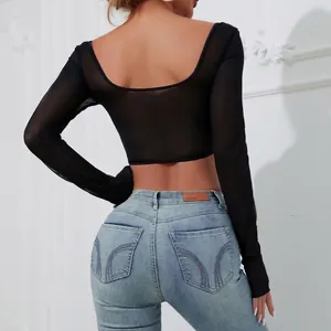 Close-up detail of a stylish black long-sleeved sheer mesh crop top with an open back