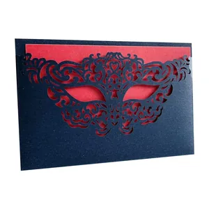 Close-up of elegant European party invitation card with detailed laser-cut mask design