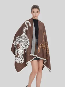 Elegant brown jacquard knit shawl with white tiger and leopard patterns on model