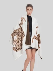 Detailed view of luxury vintage jacquard shawl with realistic tiger and leopard patterns