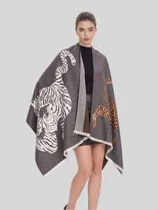 Professional model wearing an elegant gray jacquard shawl featuring tiger and leopard motifs.