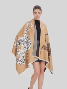Detailed front view of a retro jacquard shawl with tiger and leopard prints on a model