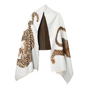 Detail of vintage jacquard scarf with artistic tiger and leopard animal patterns