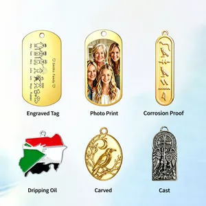 Detail of custom stainless steel pendants showing various engraving and printing techniques