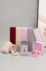 Macro view of premium velvet jewelry boxes in various pastel colors and sizes for display