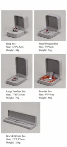 Detailed view of gray velvet jewelry boxes showing different sizes and dimensions
