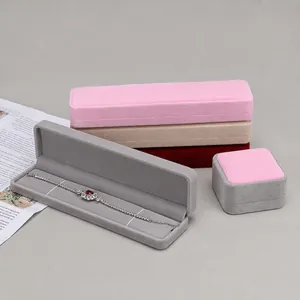 Elegant rounded velvet jewelry boxes for bracelets, rings, and necklaces in multiple colors