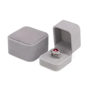 Elegant grey velvet jewelry ring boxes with rounded corners for luxury packaging
