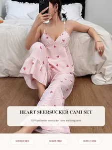 Detail of pink heart print seersucker pajama set with cami top and ruffle hem pants.