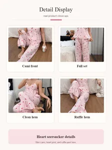 Detailed close-up view of pink seersucker heart print camisole and pants pajama set