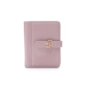 Close-up of stylish pink PU leather short wallet featuring a decorative gold leaf buckle