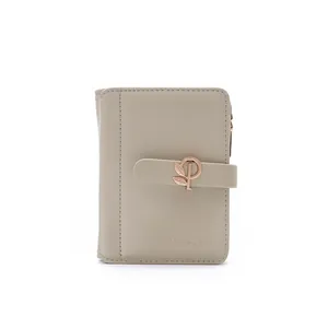 Detailed close-up of a stylish beige PU leather wallet featuring a rose gold leaf buckle