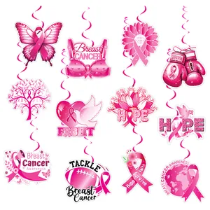 Detailed view of pink ribbon breast cancer awareness party hanging swirl decorations with glitter finish.