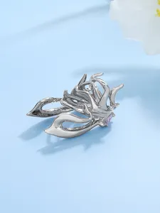 Macro view of a silver creative metallic beetle ring with purple stone accents