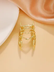 Detailed macro view of creative gold beetle-shaped insect ring with artistic metalwork