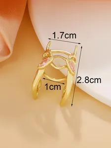 Macro view of a gold beetle insect ring with pink crystal stones showing size dimensions