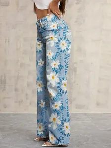 Side view of streetwear wide-leg denim pants featuring white daisy and blue text print