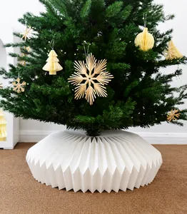 Detailed view of a white pleated Christmas tree skirt base cover decoration