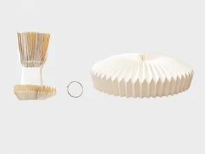 Components of pleated Christmas tree skirt base with folded skirt and metal ring