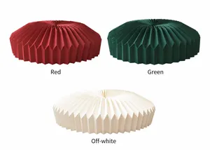 Detailed view of the pleated Christmas tree skirt base in red, green, and off-white.