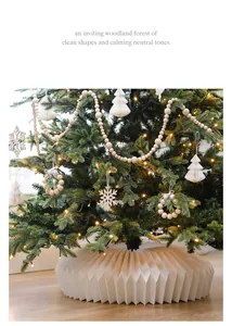 Cozy Christmas tree with pleated white base cover and neutral wooden bead ornaments